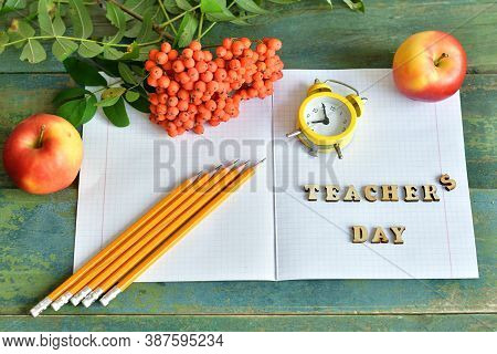 Wooden Letters Teacher's Day On The Notebook.happy Teacher's Day. Books, Rowan, Apple And Medical Pr
