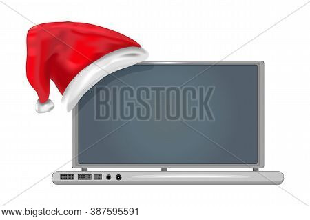 Christmas Laptop Isolated On White Background. Christmas Or New Year Laptop With Red Santas Hat. Chr