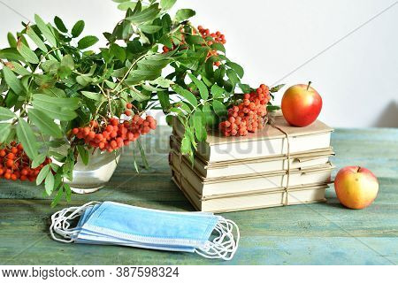 Happy Teacher's Day. Books, Rowan, Apple And Medical Protective Mask With Copy Space, Still Life.cov