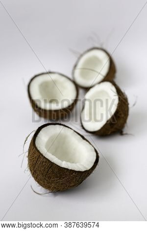 Pieces Of Coconut On White Background. Broken Coconut Closeup