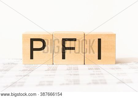Word Pfi. Wooden Small Cubes With Letters Isolated On White Background With Copy Space Available.bus