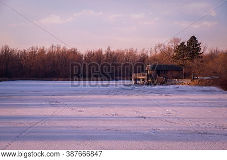 Frozen Pond Lit With Pink Sunset Sun Rays In Unionville, Markham, Ontario, Canada
