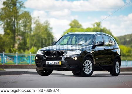 Grodno, Belarus - June 2020: Bmw X3 Ii F25 2.0i Xdrive Front Three Fourth View Outdoors On Sunny Roa