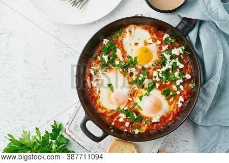 Shakshouka, Eggs Poached In Sauce Of Tomatoes, Olive Oil. Mediterranean Cousine.