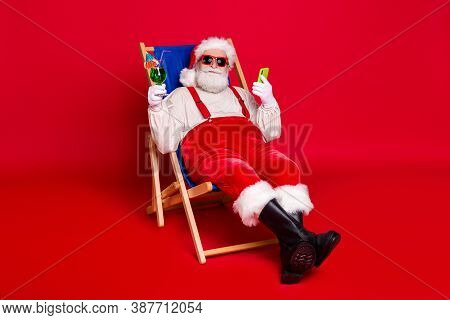Portrait Of His He Nice Handsome Cheery Bearded Fat Santa Father Hipster Sitting In Chair Drinking C