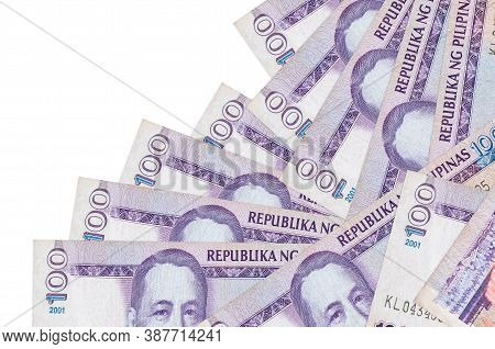 100 Philippine Piso Bills Lies In Different Order Isolated On White. Local Banking Or Money Making C