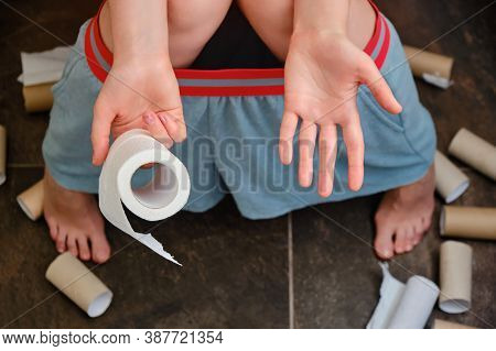 The Woman Has Diarrhea And Problems With Stomach Pain. Leftover Toilet Paper In Hand, Ended Rolls Ar