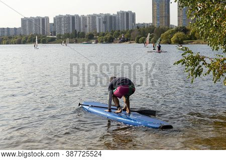 Standup Paddleboarding Are On The River Moscow, Strogino.