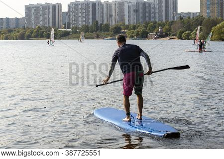 Standup Paddleboarding Are On The River Moscow, Strogino.