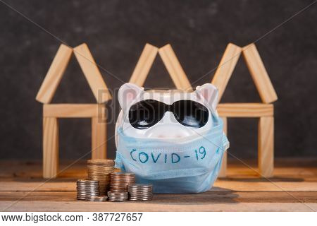 Pandemic Real Estate Crisis. Masked Piggy Bank