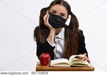 Girl With Protective Mask Ready To School Lesson. New Rulles In Education System. Isolated White Bac