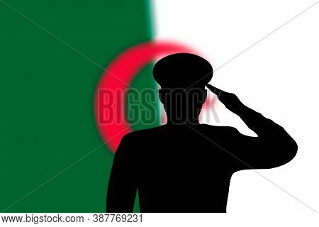 Solder Silhouette On Blur Background With Algeria Flag.
