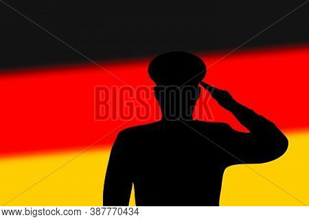 Solder Silhouette On Blur Background With Germany Flag.