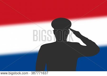 Solder Silhouette On Blur Background With Netherlands Flag.