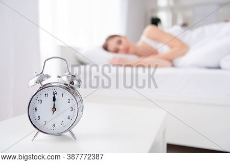 Blurry Focus Photo Of Charming Lady Sleeping Bed White Sheets Blanket Calm Sure Metal Alarm Clock Ri