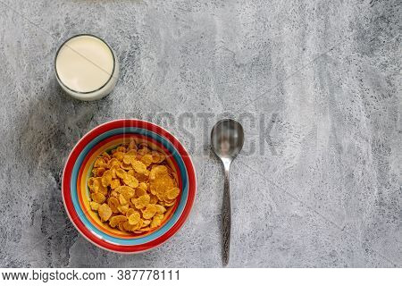 Cornflakes With Milk In A Colorful Plate