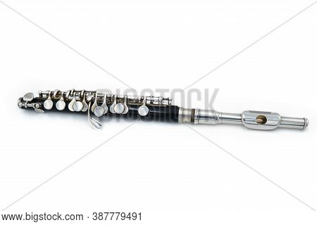 Black Piccola Flute On A White Isolated Background