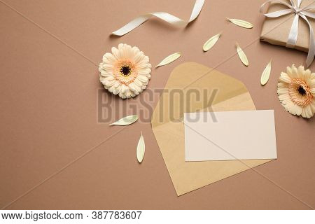 Beautiful Herbera Flowers, Gift, Envelope And Blank Card With Space For Text On Brown Background, Fl