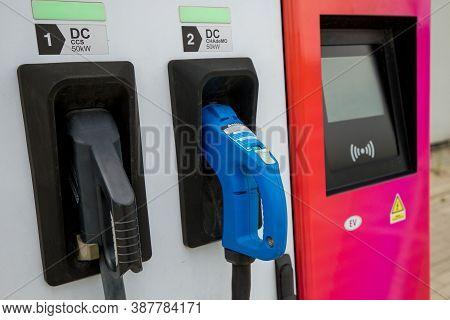 Katowice, Poland 18.07.2020 - Power Supply For Electric Car Charging. Pink Electric Car Charging Sta