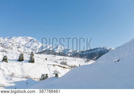 Mountain Peaks Of The Tien Shan Covered With Snow. Beldersay Resort