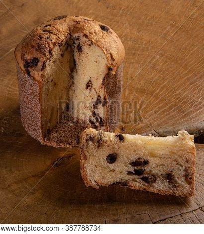 Panettone With Chocolate Chips On Rustic Wood Selective Focus.