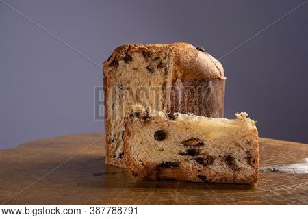 Panettone With Chocolate Chips On Rustic Wood With Gray Background, Selective Focus.