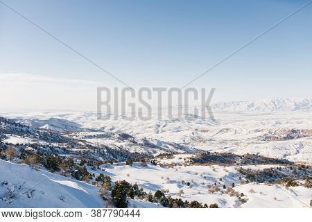 Panorama Of The Tien Shan Mountains Covered With Snow In Sunny Weather. Winter Landscape In The Moun