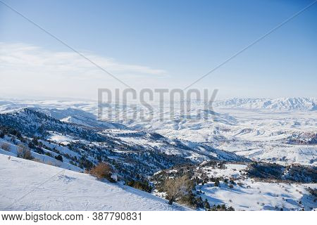 Mountain Peaks Covered With Snow In Uzbekistan On A Clear Day. Beldersay Ski Resort