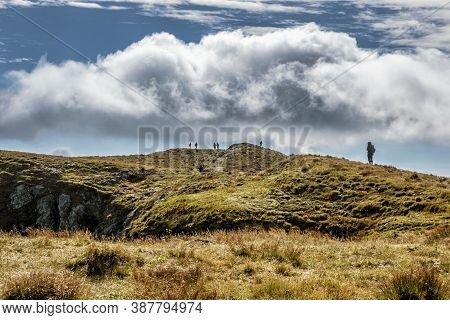Tourists In Salatin Peak, Western Tatras Mountains, Slovak Republic. Hiking Theme. Seasonal Natural 