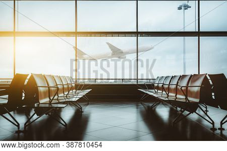 An Empty Waiting Hall Of A Contemporary Airport With Empty Rows Of Seats During Lockdown And Quarant
