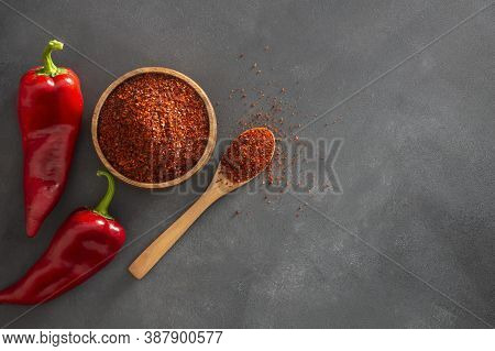 Fresh Capia Peppers And Chili Flakes Or Powder In Wooden Spoon On Grey Rustic Table, Healthy Turkish