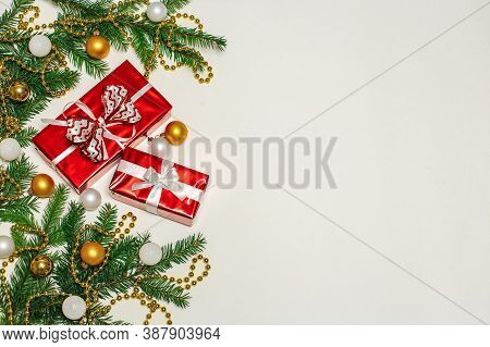 Christmas Composition, Gifts, Fir Branches, Cones, Toys. Decorations On A White Background