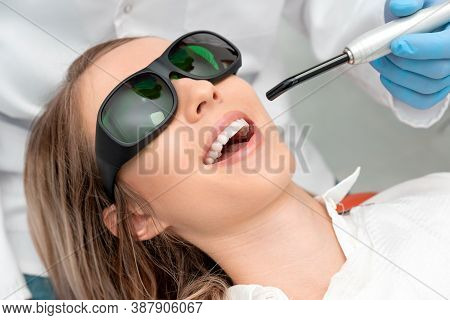 Using A Modern Method Of Laser Teeth Treatment. Dental Care, Perfect Smile