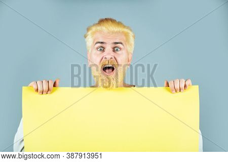 Business Concept. Man Holding Blank Paper Board Studio Portrait. Presentation. Insert Text Or Slogan