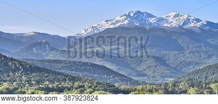 Panoramic View Of Snow Capped Summits And Forested Foothills Of The French Pyrenees. To Left Is The 