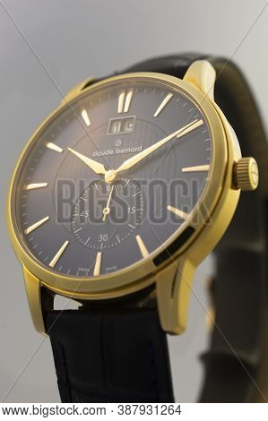 Geneve, Switzerland 01.10.2020 - Claude Bernard Man Swiss Made Watch Gold Pvd Coating Leather Strap 