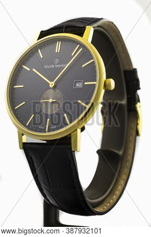 Geneve, Switzerland 01.10.2020 - Claude Bernard Man Swiss Made Watch Gold Pvd Coating Leather Strap 