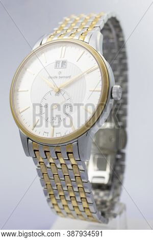 Geneve, Switzerland 01.10.2020 - Claude Bernard Swiss Made Watch Gold Pvd Coating White Dial Metal B
