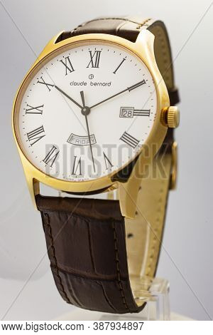Geneve, Switzerland 01.10.2020 - Claude Bernard Man Swiss Made Watch Gold Pvd Coating White Dial Lea