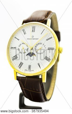 Geneve, Switzerland 01.10.2020 - Claude Bernard Man Swiss Made Watch Moon Calendar Gold Pvd Coating 
