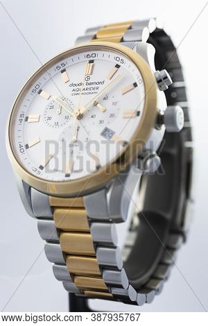 Geneve, Switzerland 01.10.2020 - Claude Bernard Man Swiss Made Watch Gold Pvd Coating White Dial Met