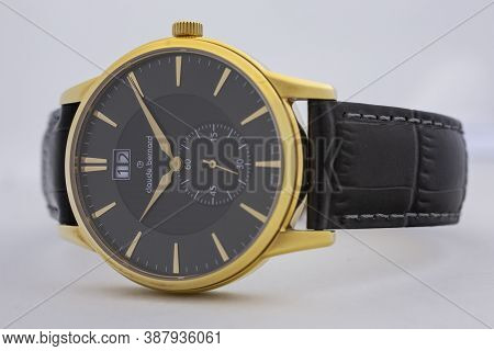 Geneve, Switzerland 01.10.2020 - Claude Bernard Man Swiss Made Watch Gold Pvd Coating Black Dial Lea