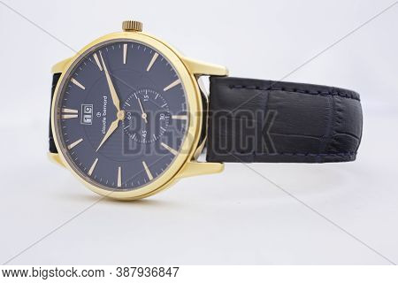 Geneve, Switzerland 01.10.2020 - Claude Bernard Man Swiss Made Watch Gold Pvd Coating Blue Dial Leat