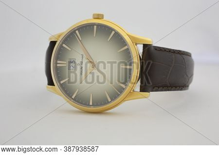 Geneve, Switzerland 01.10.2020 - Claude Bernard Man Swiss Made Watch Gold Pvd Coating Leather Strap 