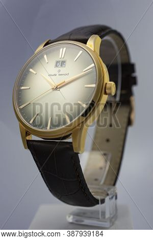 Geneve, Switzerland 01.10.2020 - Claude Bernard Man Swiss Made Watch Gold Pvd Coating Leather Strap 