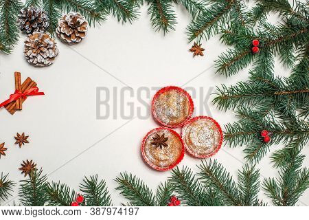 Christmas Composition Pastries, Cinnamon, Pine Cones On The Table,gold Ornaments On Fir Branches, Gi