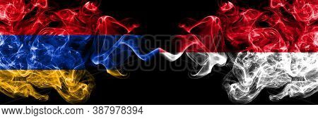 Armenia Vs Monaco, Monacan Smoky Mystic Flags Placed Side By Side. Thick Colored Silky Abstract Smok