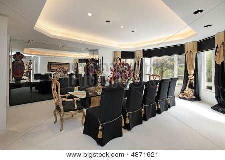 Elegant Dining Room With Black Chairs