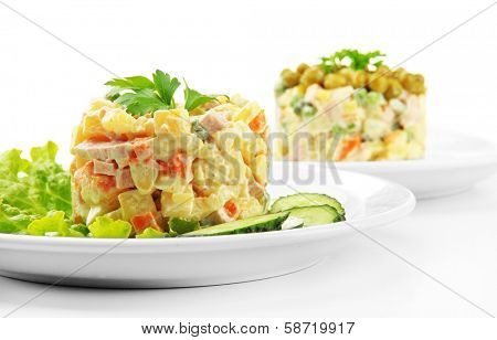 Russian traditional salad Olivier, isolated on white