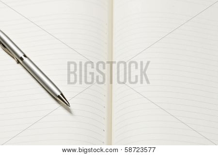 pen and open notepad
